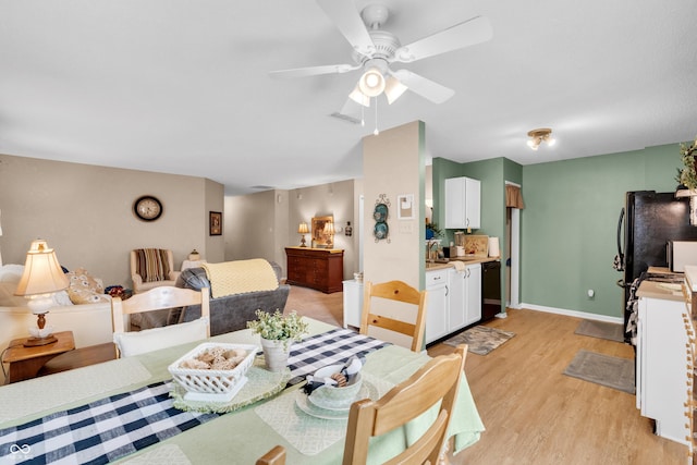 1912 Blue Pine Ln, Indianapolis, IN 46231 - dining room with light wood-type flooring and ceiling fan