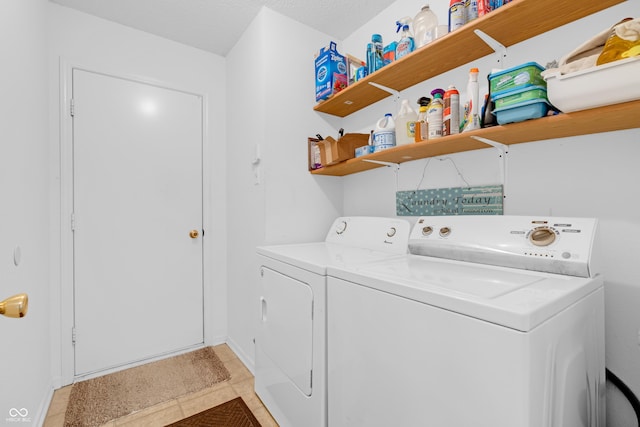 1912 Blue Pine Ln, Indianapolis, IN 46231 - laundry room with washer and dryer and light tile patterned flooring