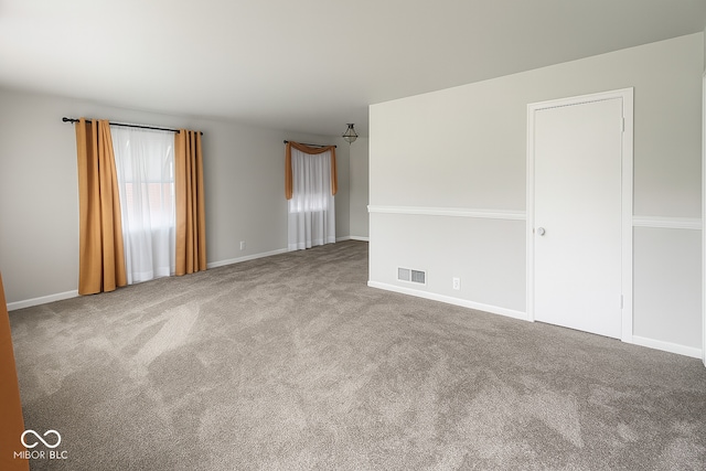 3642 N Dequincy St, Indianapolis, IN 46218 - carpeted spare room with baseboards