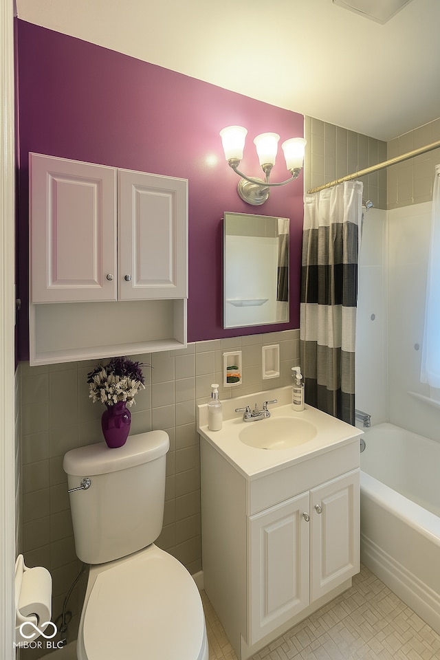 3642 N Dequincy St, Indianapolis, IN 46218 - bathroom featuring tile walls, vanity, and shower / bath combo