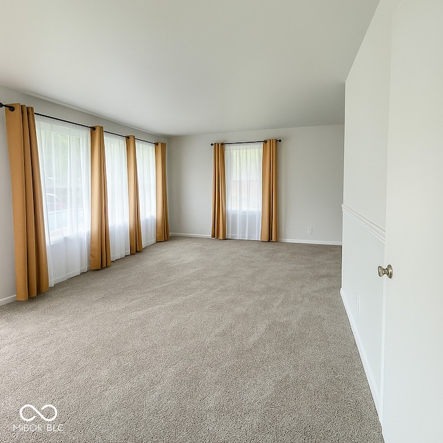 3642 N Dequincy St, Indianapolis, IN 46218 - empty room featuring carpet flooring and baseboards