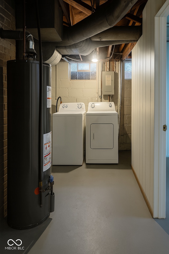 3642 N Dequincy St, Indianapolis, IN 46218 - below grade area with water heater, washer and dryer, electric panel, and concrete block wall