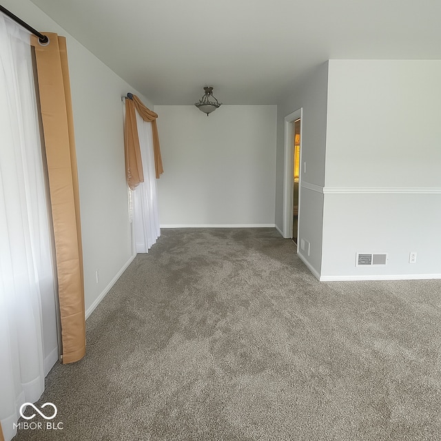 3642 N Dequincy St, Indianapolis, IN 46218 - carpeted empty room featuring baseboards
