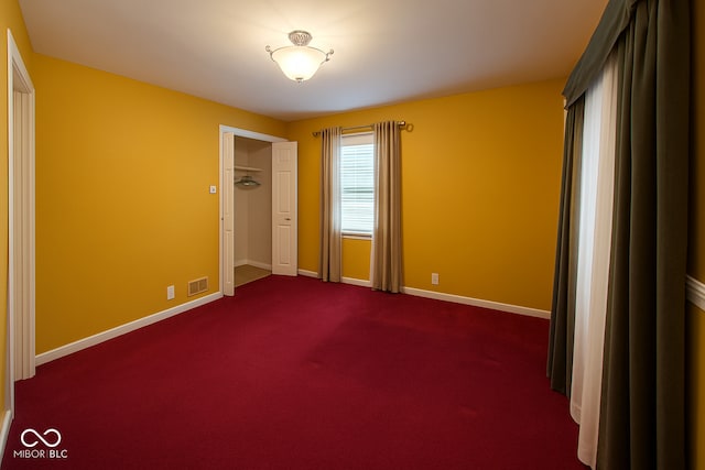 3642 N Dequincy St, Indianapolis, IN 46218 - unfurnished bedroom with baseboards and dark colored carpet