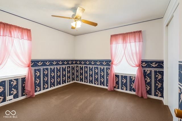 3642 N Dequincy St, Indianapolis, IN 46218 - spare room with carpet flooring, ceiling fan, and wallpapered walls