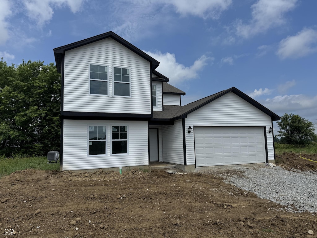 1123 Lake Dr, Shirley, IN 47384 - view of front of house featuring an attached garage and dirt driveway