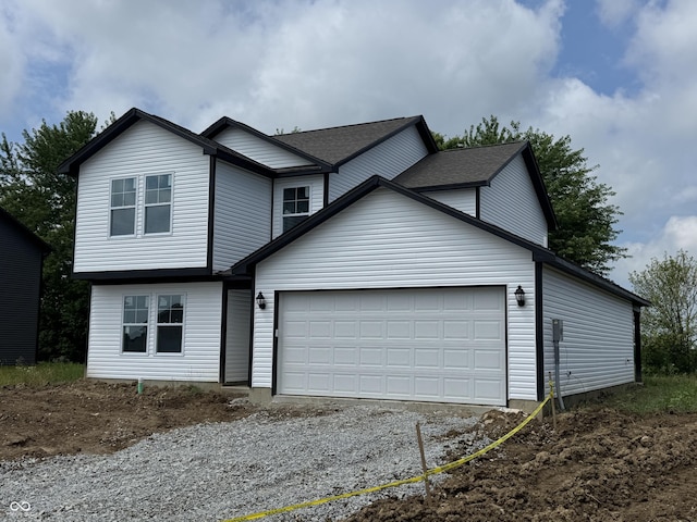 1123 Lake Dr, Shirley, IN 47384 - traditional-style home featuring an attached garage and gravel driveway