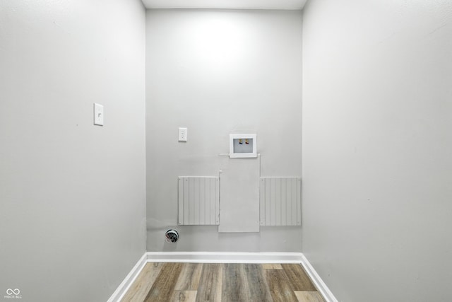 452 N Fenton Ave, Indianapolis, IN 46219 - washroom with radiator heating unit, wood finished floors, and hookup for a washing machine