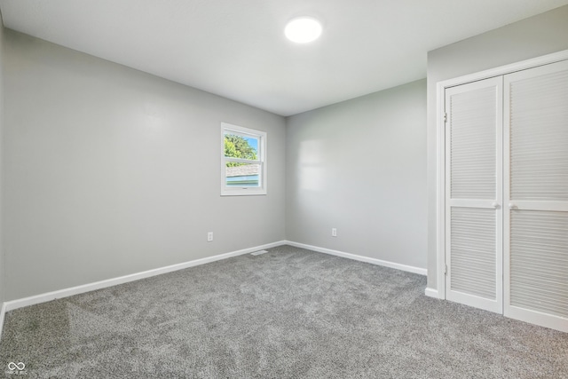 452 N Fenton Ave, Indianapolis, IN 46219 - unfurnished bedroom with carpet and a closet