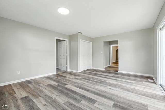 452 N Fenton Ave, Indianapolis, IN 46219 - empty room with wood finished floors and arched walkways