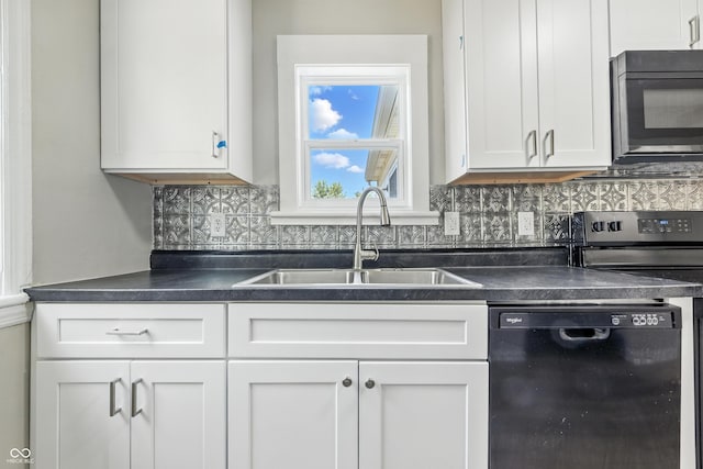 452 N Fenton Ave, Indianapolis, IN 46219 - kitchen featuring black appliances, dark countertops, white cabinetry, and tasteful backsplash