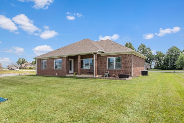 1976 Austin James Ln, Seymour, IN 47274 - back of property with brick siding, a lawn, and roof with shingles
