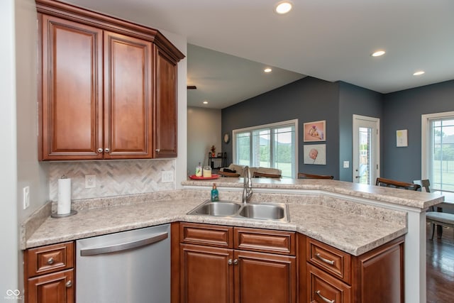 1976 Austin James Ln, Seymour, IN 47274 - kitchen with stainless steel dishwasher, a peninsula, light countertops, brown cabinets, and recessed lighting