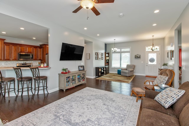 1976 Austin James Ln, Seymour, IN 47274 - living room with a chandelier, a ceiling fan, dark wood-style flooring, and recessed lighting