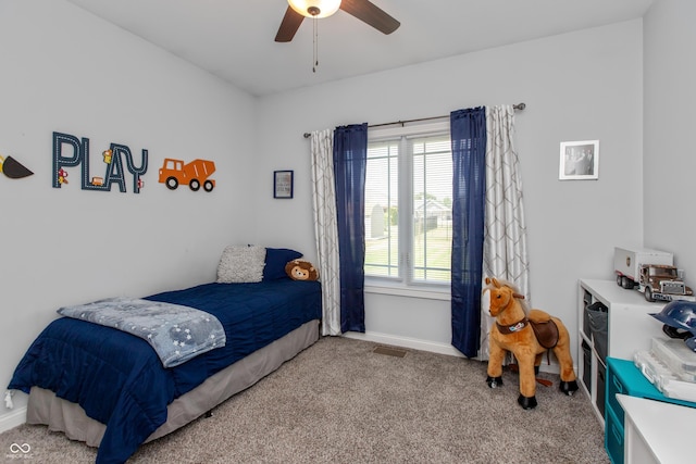 1976 Austin James Ln, Seymour, IN 47274 - carpeted bedroom featuring baseboards and a ceiling fan