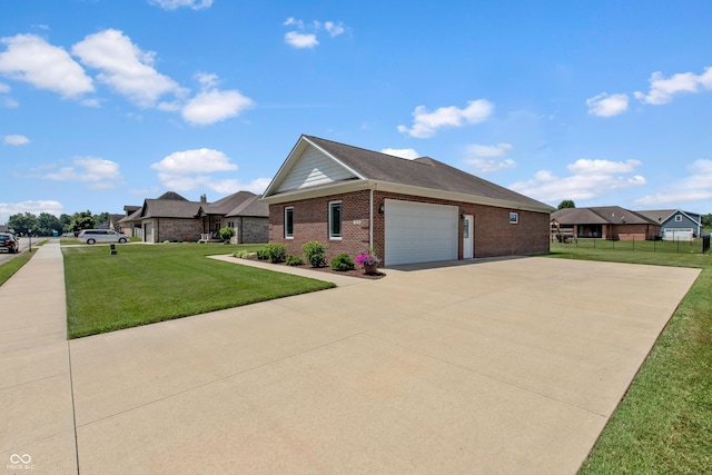 1976 Austin James Ln, Seymour, IN 47274 - view of home's exterior featuring an attached garage, concrete driveway, and brick siding