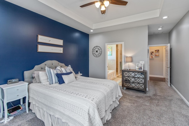1976 Austin James Ln, Seymour, IN 47274 - carpeted bedroom featuring recessed lighting, a ceiling fan, connected bathroom, and a raised ceiling