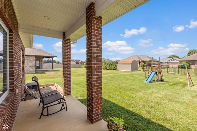 1976 Austin James Ln, Seymour, IN 47274 - view of patio featuring a playground