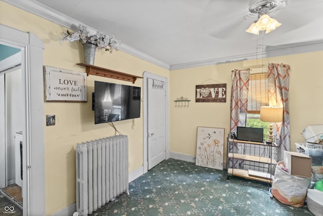 38 W Main St, Brownsburg, IN 46112 - living room featuring radiator heating unit, carpet, crown molding, and ceiling fan