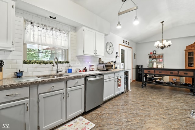 1346 N Buck Creek Rd, Greenfield, IN 46140 - kitchen featuring stainless steel dishwasher, vaulted ceiling, backsplash, a chandelier, and pendant lighting