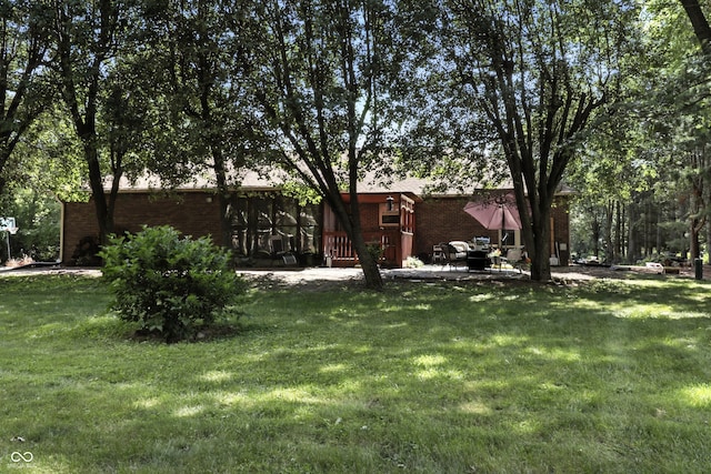 1346 N Buck Creek Rd, Greenfield, IN 46140 - view of grassy yard featuring a patio