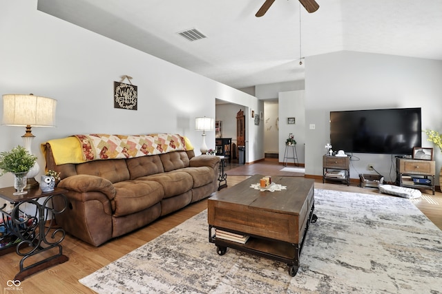 1346 N Buck Creek Rd, Greenfield, IN 46140 - living area with wood finished floors, a ceiling fan, and vaulted ceiling