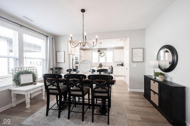 2856 Old Rosebud Ln, Westfield, IN 46074 - dining area with a chandelier and wood finished floors