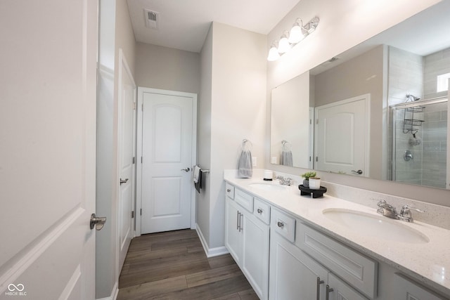 2856 Old Rosebud Ln, Westfield, IN 46074 - full bath with double vanity, a shower stall, and wood finished floors