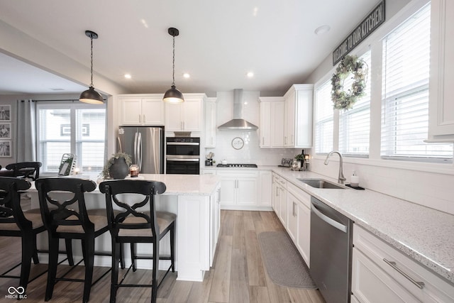 2856 Old Rosebud Ln, Westfield, IN 46074 - kitchen with stainless steel appliances, wall chimney exhaust hood, backsplash, white cabinetry, and healthy amount of natural light