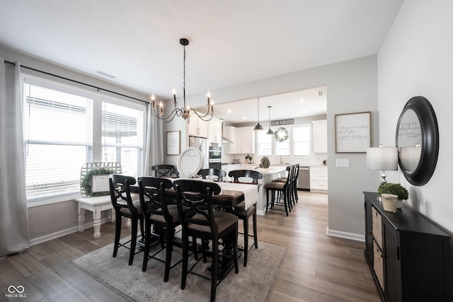 2856 Old Rosebud Ln, Westfield, IN 46074 - dining area featuring a chandelier, wood finished floors, and recessed lighting
