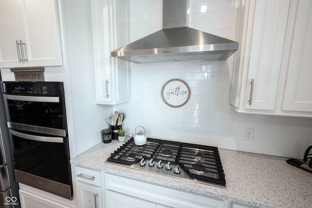 2856 Old Rosebud Ln, Westfield, IN 46074 - kitchen with wall chimney range hood, stainless steel gas cooktop, double wall oven, backsplash, and white cabinetry
