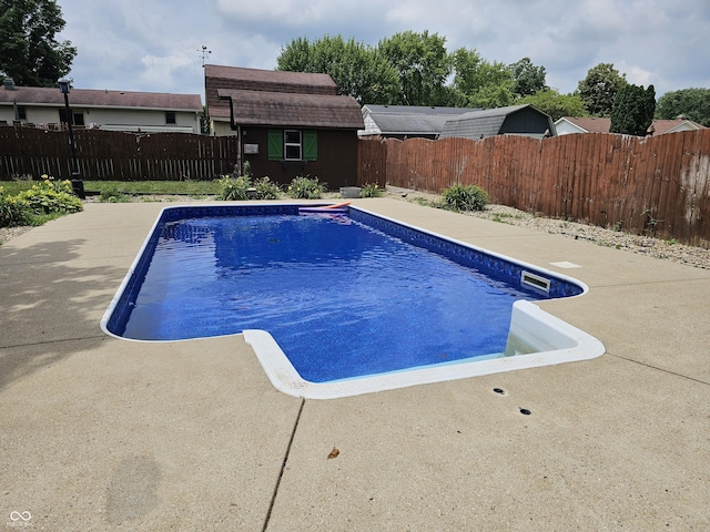 2239 Chevelle Ct, Anderson, IN 46012 - view of swimming pool featuring a fenced backyard and a storage shed