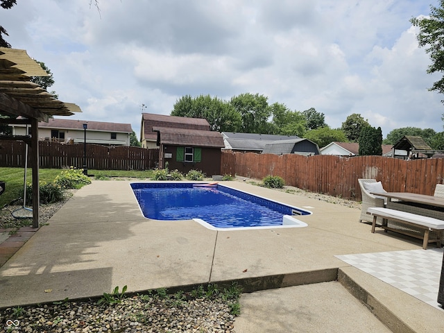 2239 Chevelle Ct, Anderson, IN 46012 - view of pool featuring a patio area, a fenced backyard, and a storage shed