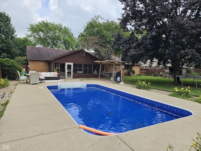 2239 Chevelle Ct, Anderson, IN 46012 - view of pool with outdoor lounge area, a patio, and a trampoline
