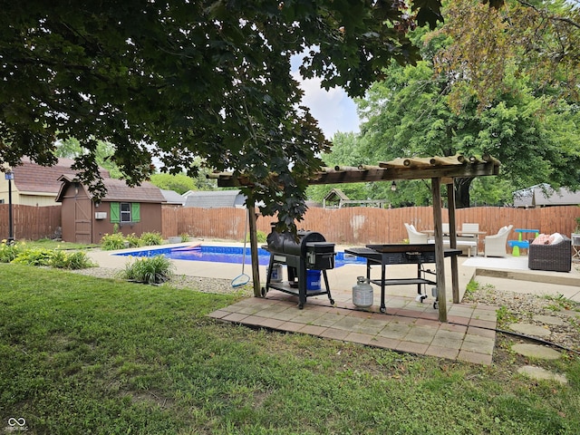 2239 Chevelle Ct, Anderson, IN 46012 - fenced backyard with a patio, a storage unit, and an outdoor living space