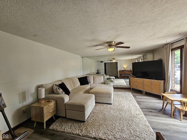 2239 Chevelle Ct, Anderson, IN 46012 - living area with a ceiling fan, dark wood-type flooring, and a textured ceiling