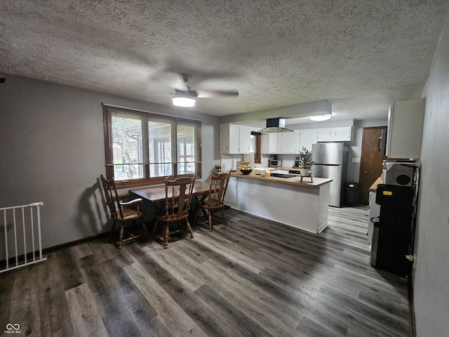 2239 Chevelle Ct, Anderson, IN 46012 - dining room with wood finished floors, a textured ceiling, and ceiling fan