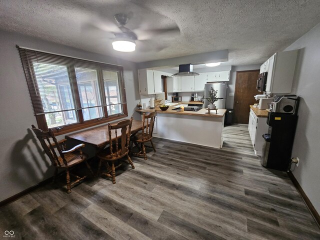 2239 Chevelle Ct, Anderson, IN 46012 - dining room with a textured ceiling, wood finished floors, and ceiling fan