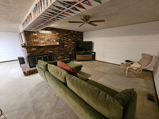 2239 Chevelle Ct, Anderson, IN 46012 - living area featuring a textured ceiling, carpet, a ceiling fan, a brick fireplace, and brick wall