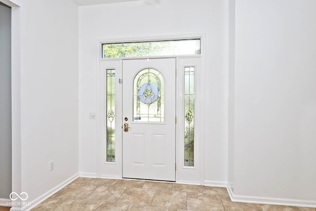 8909 Carnation Dr, Noblesville, IN 46060 - foyer entrance featuring baseboards and stone finish flooring