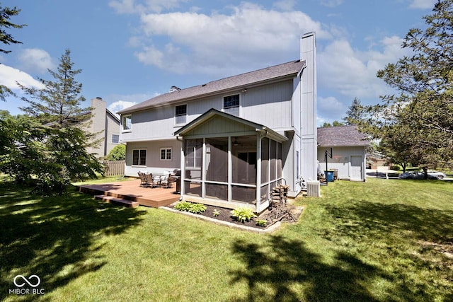 8909 Carnation Dr, Noblesville, IN 46060 - back of house with a sunroom, a chimney, a lawn, and a wooden deck