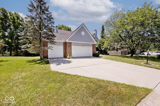 8909 Carnation Dr, Noblesville, IN 46060 - view of front of home featuring brick siding, a chimney, a front yard, and concrete driveway