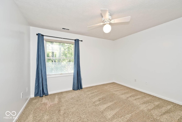 8909 Carnation Dr, Noblesville, IN 46060 - spare room featuring carpet, a textured ceiling, and a ceiling fan