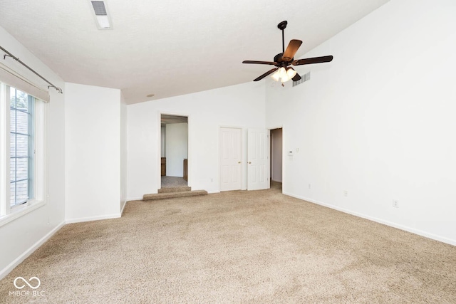 8909 Carnation Dr, Noblesville, IN 46060 - unfurnished room with carpet, vaulted ceiling, plenty of natural light, and a ceiling fan