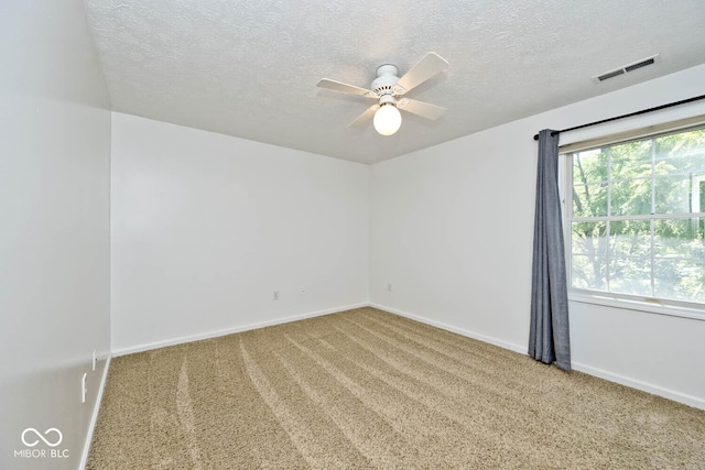 8909 Carnation Dr, Noblesville, IN 46060 - unfurnished room featuring a textured ceiling, ceiling fan, and carpet flooring