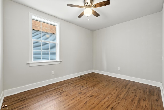 1151 S Randolph St, Indianapolis, IN 46203 - empty room with healthy amount of natural light, wood finished floors, and ceiling fan