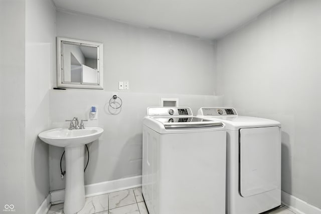 1151 S Randolph St, Indianapolis, IN 46203 - laundry room with independent washer and dryer and light marble finish flooring