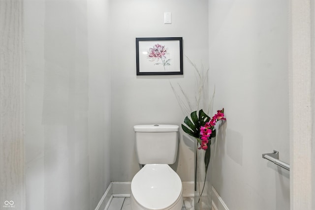 1151 S Randolph St, Indianapolis, IN 46203 - bathroom featuring baseboards and toilet