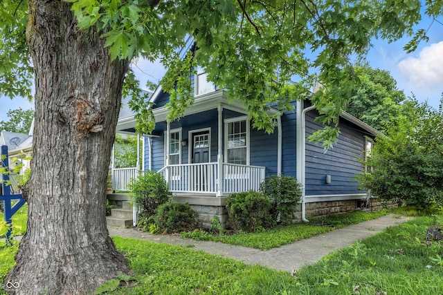 1151 S Randolph St, Indianapolis, IN 46203 - shotgun-style home with covered porch
