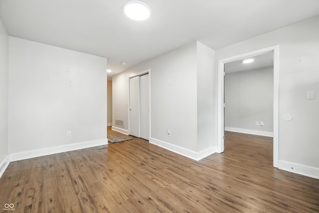 1151 S Randolph St, Indianapolis, IN 46203 - spare room featuring wood finished floors and baseboards